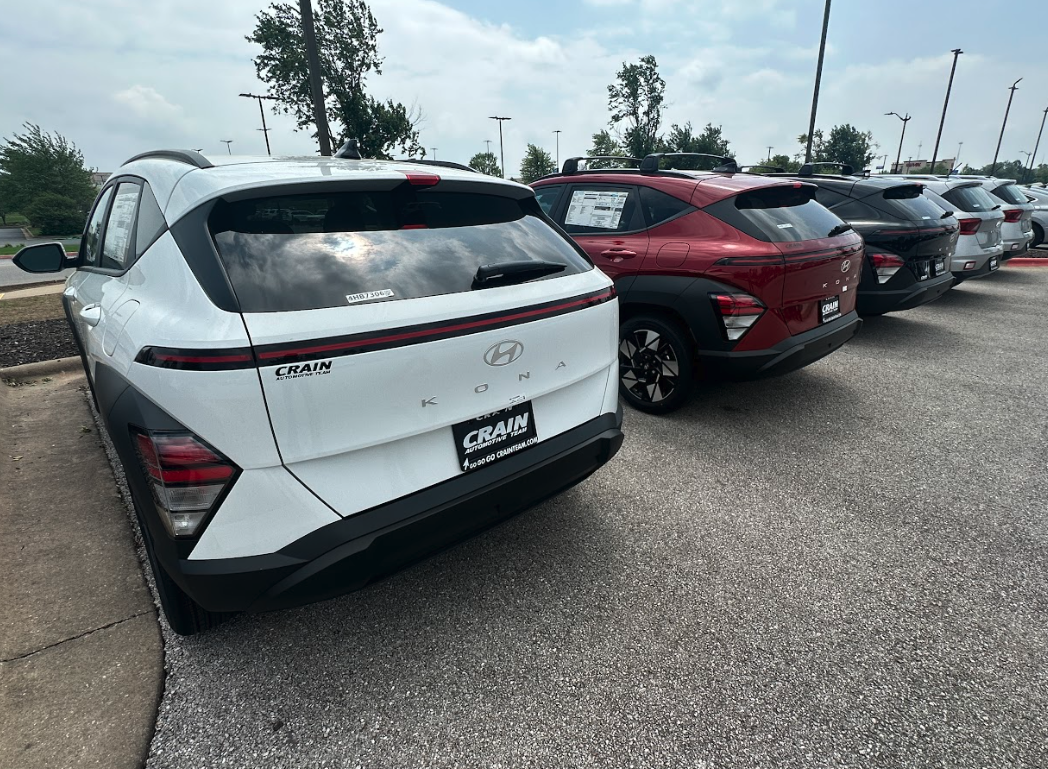 Rear view of multiple Hyundai Kona SUVs at Crain Hyundai of Bentonville dealership lot